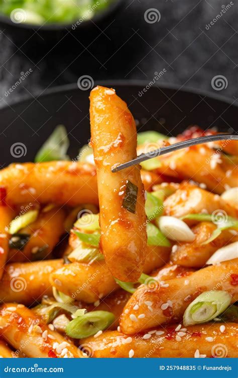 Tteokbokki, Topokki Fried Rice Cake Stick in Black Bowl. Korean Street Food Stock Image - Image ...