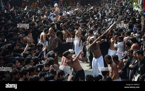 Pakistani Shiite Muslim flagellate themselves during a religious procession held ahead of Ashura ...