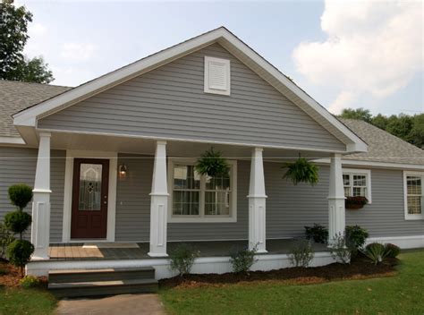 covered portico/porch/deck added to the front of a long, straight, ranch style house. Love this ...