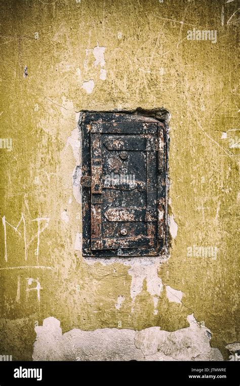 Old little rusty door with locker Stock Photo - Alamy