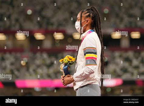 Gold medalist Nafissatou Thiam, of Belgium, stands during the medal ...