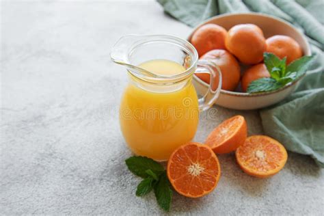 Jug of Fresh Orange Tangerine Juice Stock Photo - Image of drink, fruit: 258049974