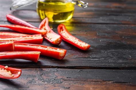 Premium Photo | Ripe chili pepper sliced for making spicy olive oil ...