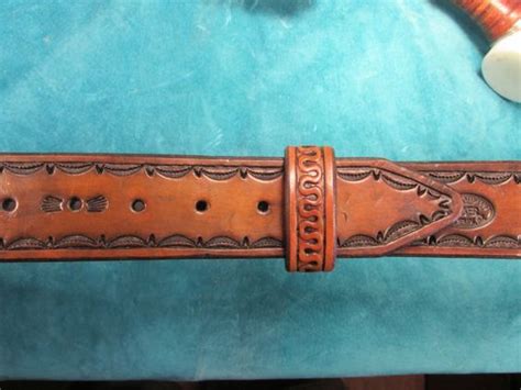 1 3/4 wide, medium brown antique finish, heavy (10-11 oz.) leather belt with hand tooled border ...