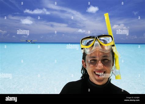 Maldives Baa atoll Woman with snorkeling equipment Stock Photo - Alamy