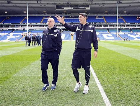 Esteban Cambiasso and Leonardo Ulloa of Leicester City inspect the ...