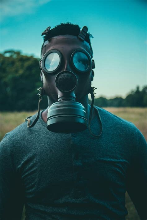 Man wearing gas mask photo – Free Grey Image on Unsplash