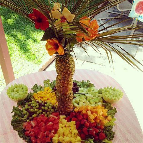 My pineapple palm tree fruit display. Added hibiscus flowers. Made this ...