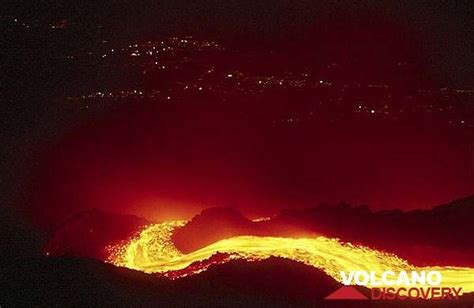 Photos >Lava Flows - Lava Flow at Night and Lights of Giarre in the Background (Etna Volcano) (c)