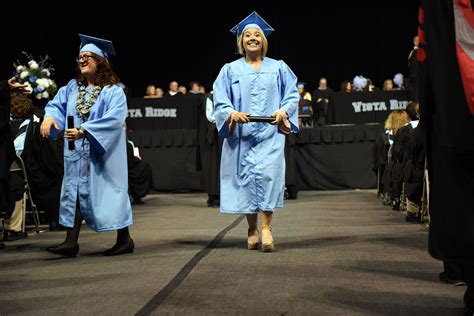 Vista Ridge High School graduates receive a diploma during a ...