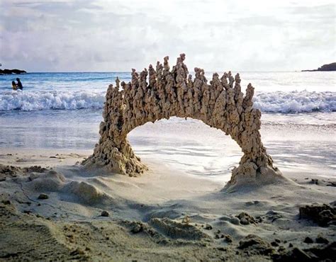 Temporary arch due to lightening hitting wet sand. | Sand sculptures, Sand castle, Sand art