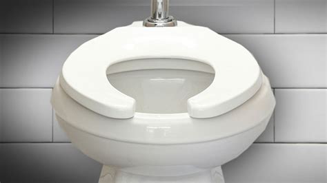 Why are toilet seats in public toilets shaped U-shaped?