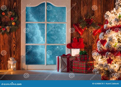 Christmas Scene With Tree Gifts And Frozen Window Stock Photo - Image: 62488678