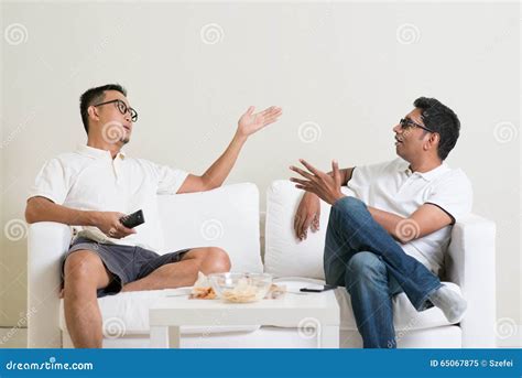 Male friends arguing stock image. Image of asian, fans - 65067875