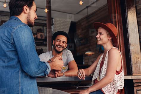 Young people hanging out at a cafe stock photo (122634) - YouWorkForThem