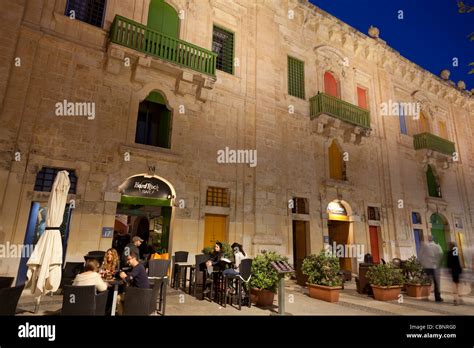 Restored wharf buildings in the Grand Harbour in Valletta that now serve as shops, cafes, clubs ...