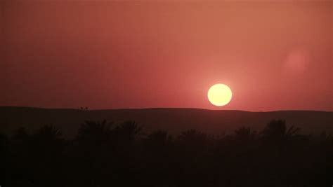 Time Lapse Of Red Sun Setting Over Desert Landscape Stock Footage Video 3939653 - Shutterstock