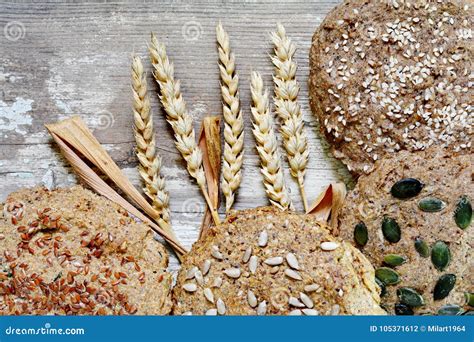 Different Types of Bread, Flour and Wheat on a Wooden Table. Stock ...