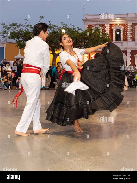 Male and Female dancers in traditional costume performing La Marinera ...