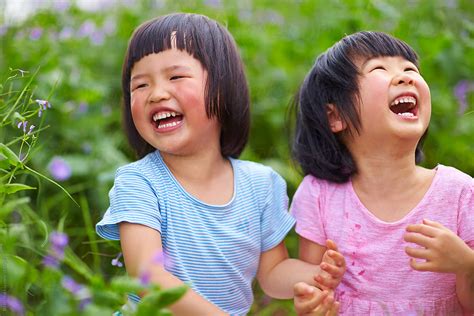 Two Happy Little Girls Laughing Outdoor | Stocksy United