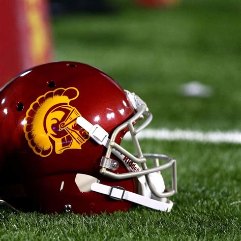 Download Usc Trojans Football Helmet Field Wallpaper | Wallpapers.com