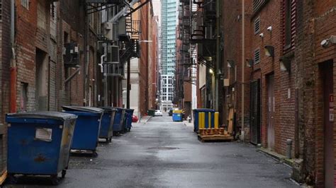 A daytime overcast establishing shot of an empty alley in a big city. - HD stock footage clip ...