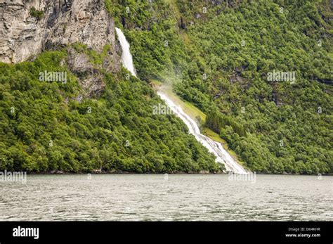 Waterfall in the Geiranger fjord Stock Photo - Alamy