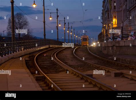 yellow tram in budapest at the night Stock Photo - Alamy