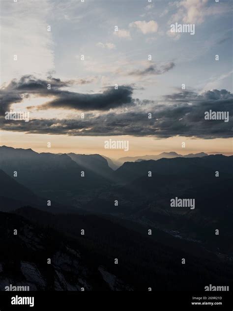 Clouds in a sunset above mountains Stock Photo - Alamy