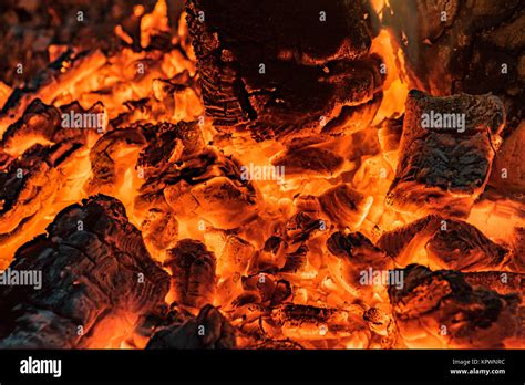 Wood fire -burning embers in close-up Stock Photo - Alamy