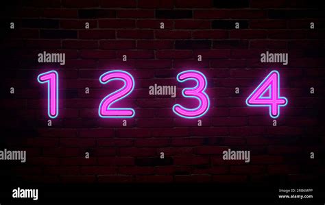 Glowing neon number (1, 2, 3, 4) signs on brick wall Stock Photo - Alamy