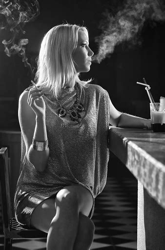 Elegant Woman Smoking Cigarette And Drinking In The Bar Stock Photo ...