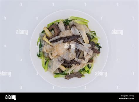 Close-up of onion sea cucumber stir-fry Stock Photo - Alamy