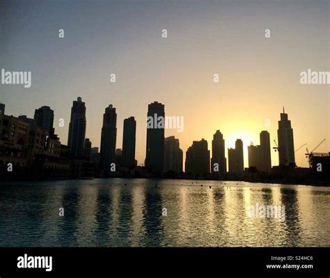 Dubai skyline at sunset Stock Photo - Alamy