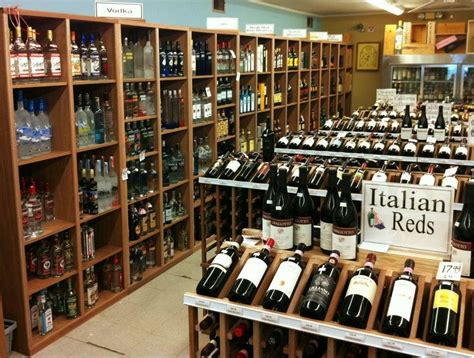 Our mahogany commercial wine racks in a store in East Hampton | Wine rack, Wine display, Cellar ...