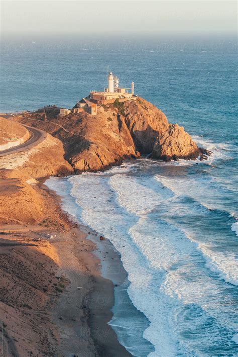 "Lighthouse In The Mediterranean Sea" by Stocksy Contributor "ACALU Studio" - Stocksy