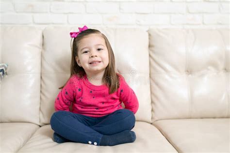 Little Girl Relaxing at Home in a Sofa Stock Image - Image of people, girl: 178596377