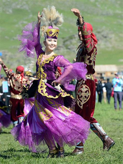 A couple performing a Kazakh dance at the 18th Aqin Aytis Fair in ...