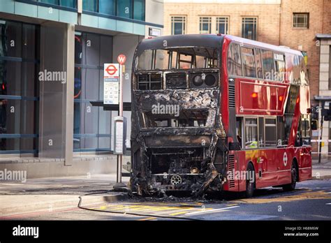 A fire-damaged bus in Bishopsgate, London Stock Photo - Alamy