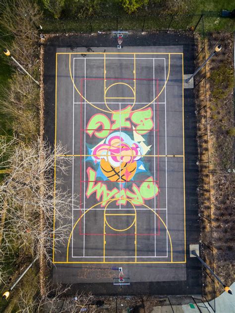 Aerial view of public basketball court cover with graffiti, Chicago ...