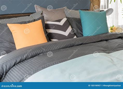 Colorful Pillows on Dark Color Bed in Modern Bedroom Stock Image ...