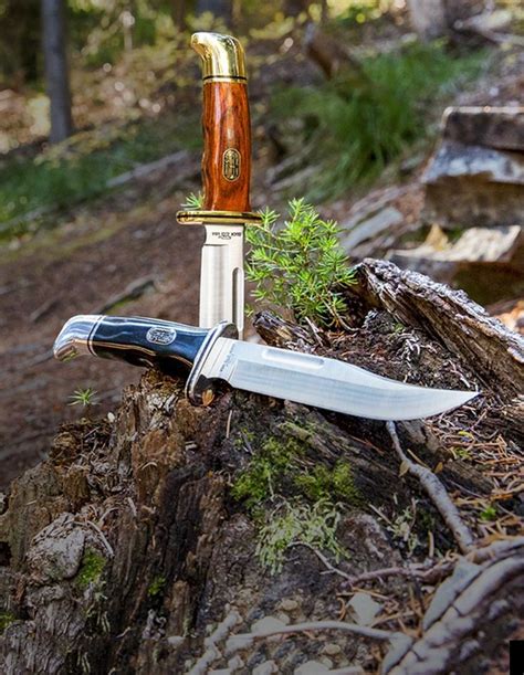 a knife sitting on top of a tree stump