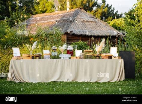 Outdoor festive banquet table set with appetizers Stock Photo - Alamy