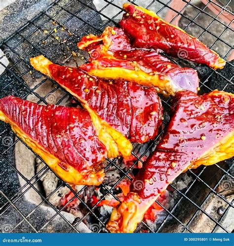 A Detailed Shot of Meat Cooking on a Grill, Showcasing the Marbling of ...