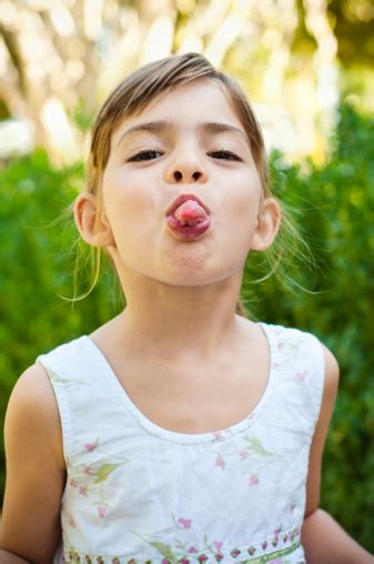 Girl Sticking Her Tongue Out Stock Photo - Download Image Now - iStock