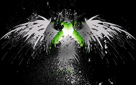 an abstract image of white and green wings with splatters on black background in the foreground