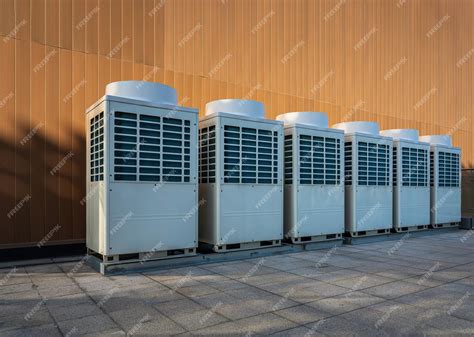 Premium Photo | Commercial air conditioning units on top of buildings