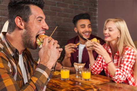 456 Group Eating Burgers Stock Photos - Free & Royalty-Free Stock ...