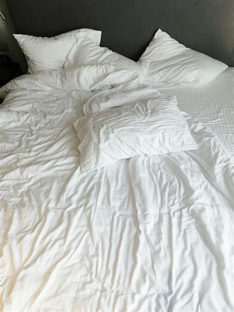 White Pillows And Bed Linen · Free Stock Photo