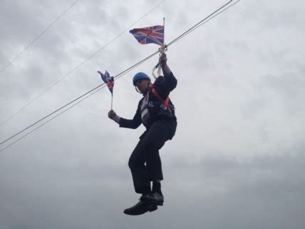 London 2012: Boris Johnson Gets Stuck Waving Flags From A Zipwire ...